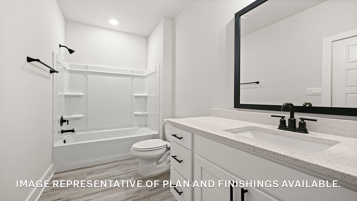 Second guest bathroom with single vanity and toilet and shower tub combo