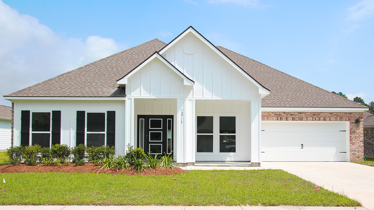 Single-story home with white hardie vinyl and red/brown brick. Black glass front door and black shutters.