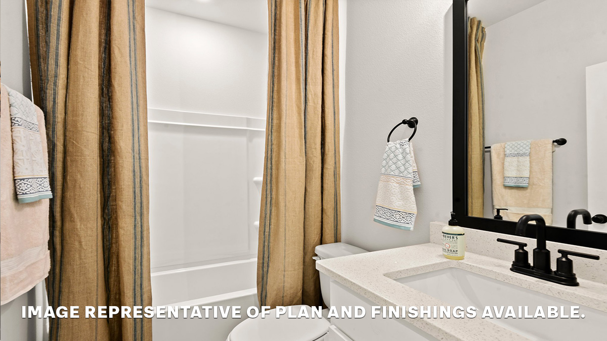 Second guest bathroom with single vanity and toilet and shower tub combo