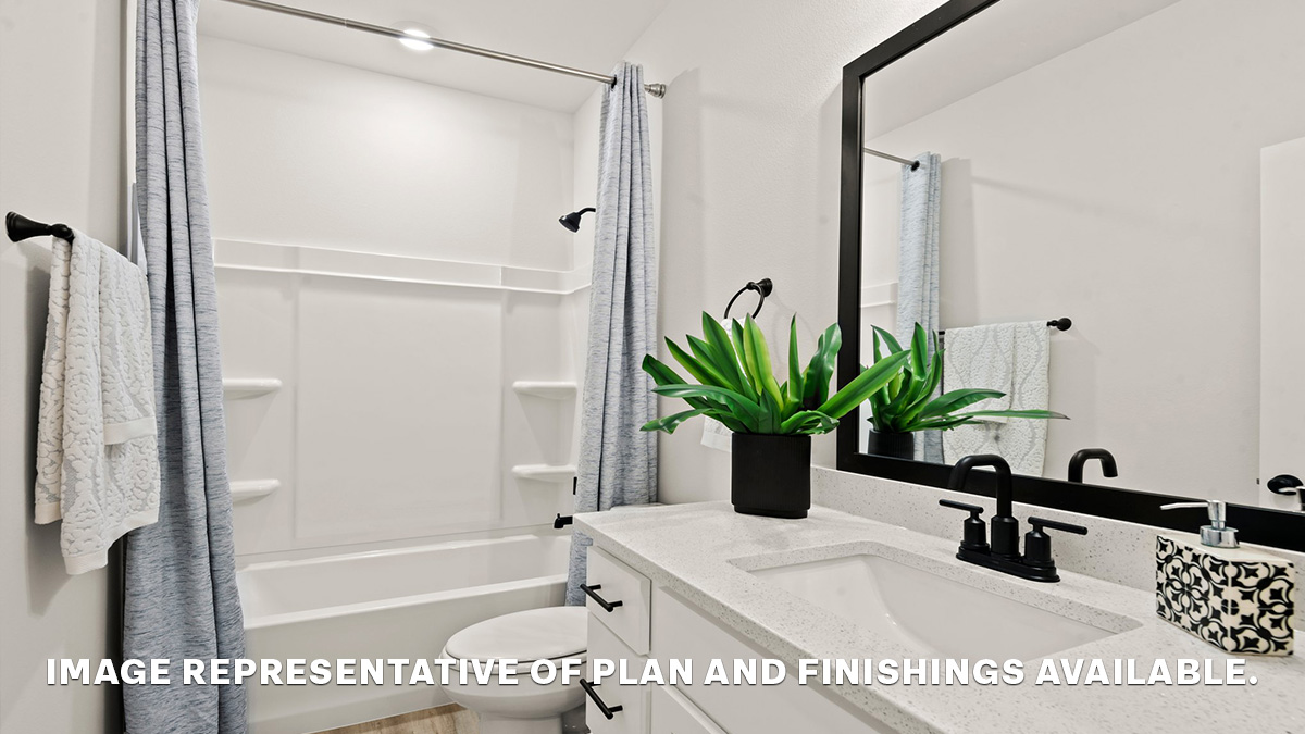 First guest bathroom with single vanity and toilet and shower tub combo