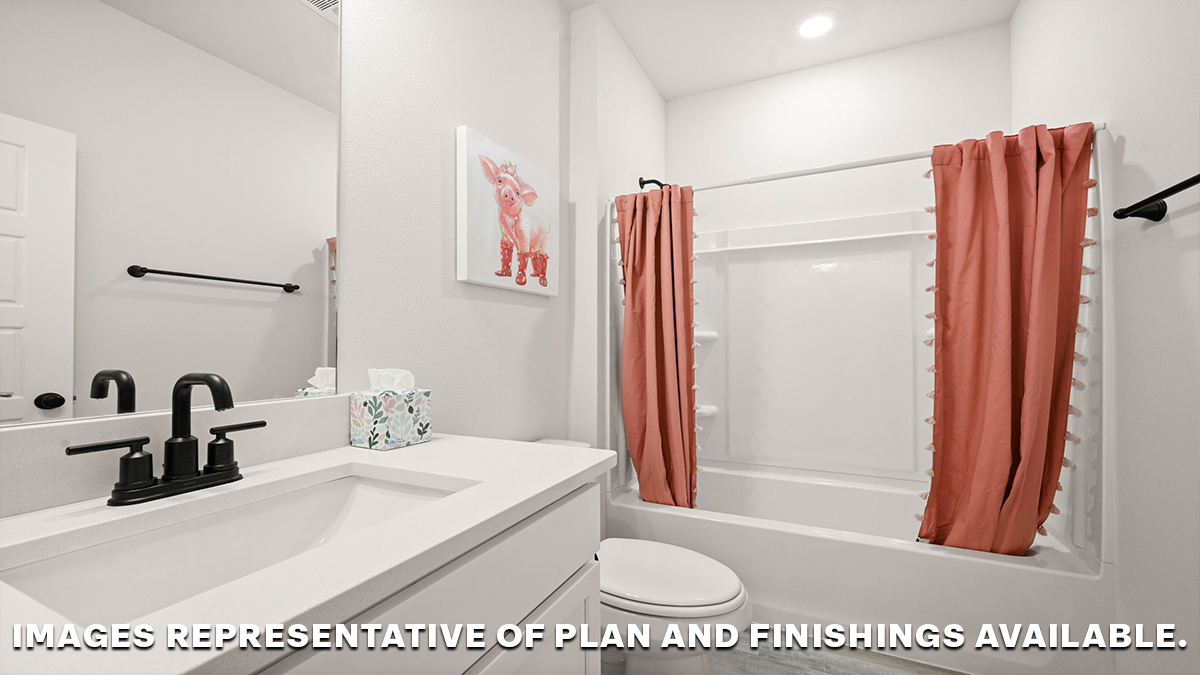 second bathroom with single vanity and toilet and shower tub combo