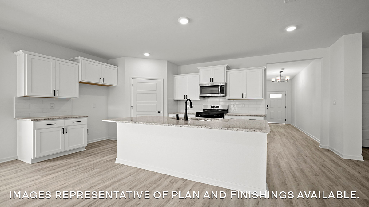 white kitchen island with stainless steel appliances