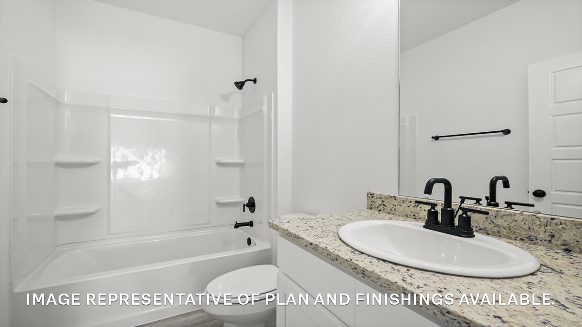 second bathroom with single vanity and toilet and shower tub combo