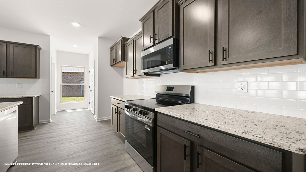 dark kitchen cabinets with stainless steel appliances and pantry