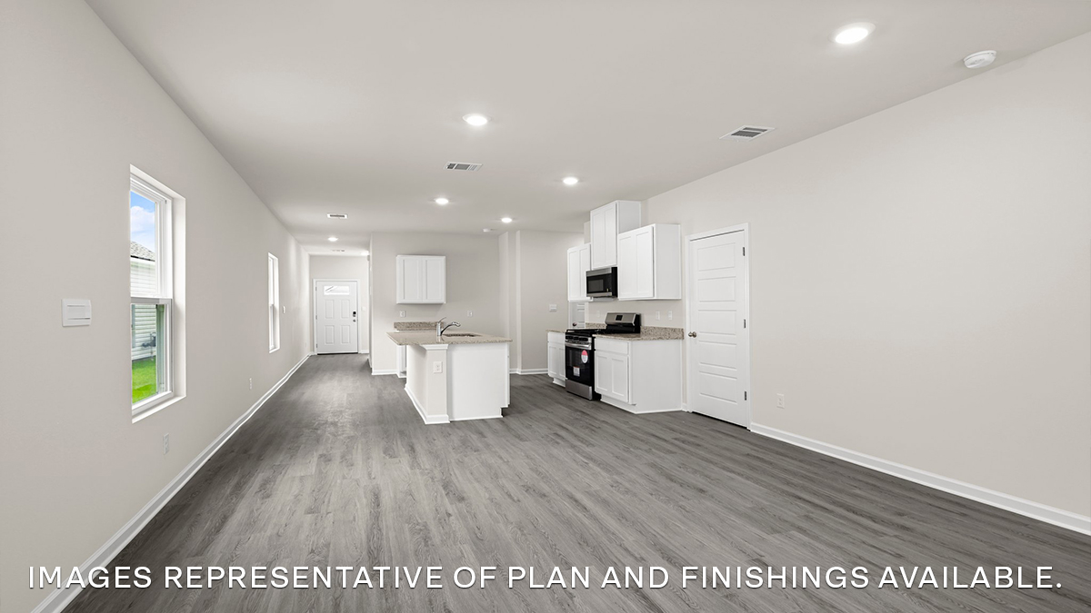 open-concept living room and dining room leading to the kitchen