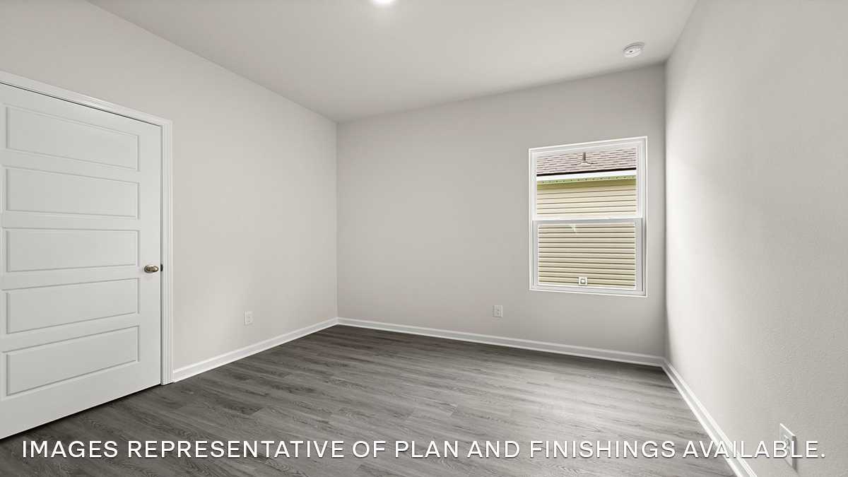 third bedroom with single window and room for a full or queen bed