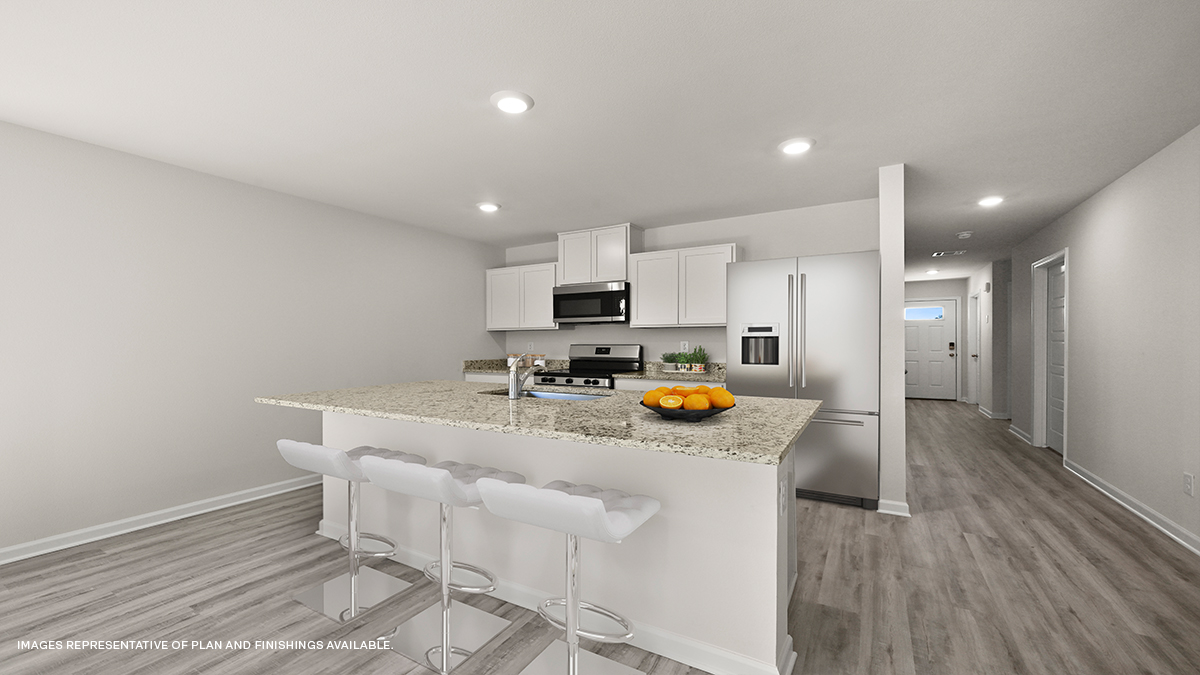 white kitchen island with stainless steel appliances