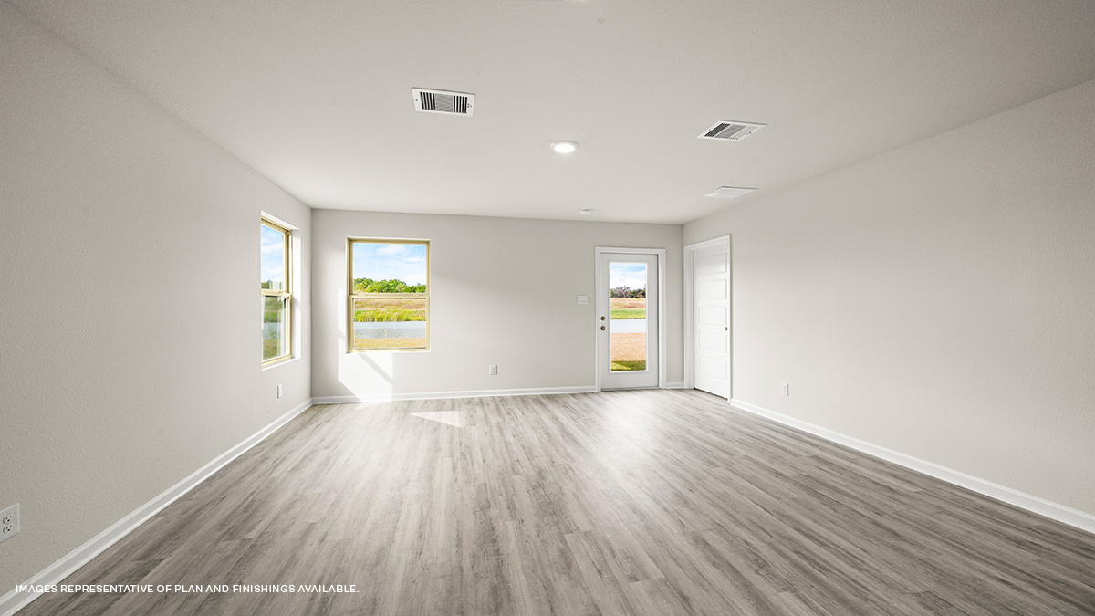 Open-concept living room with backyard access