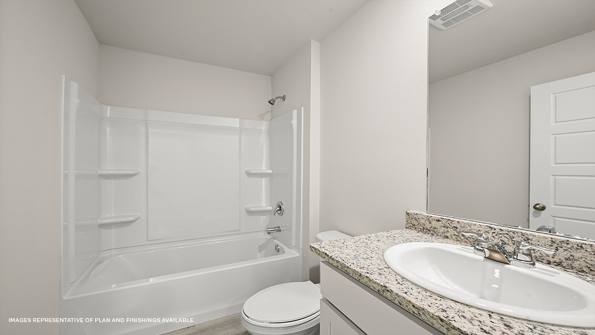 Guest bathroom with single vanity mirror and shower tub combo