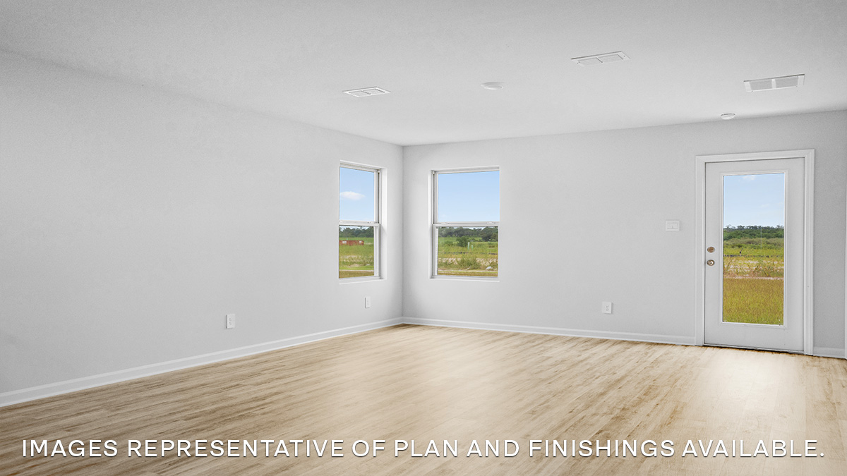 Open-concept living room with backyard access