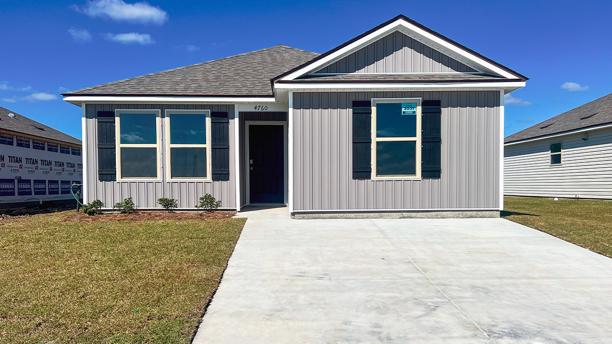 single-story home with light gray vinyl siding and black front door and shutters and porch