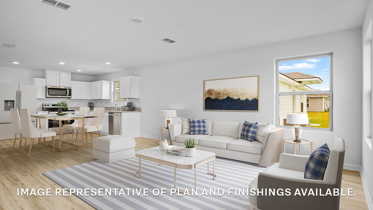 Open-concept living room with dual windows facing front of the home