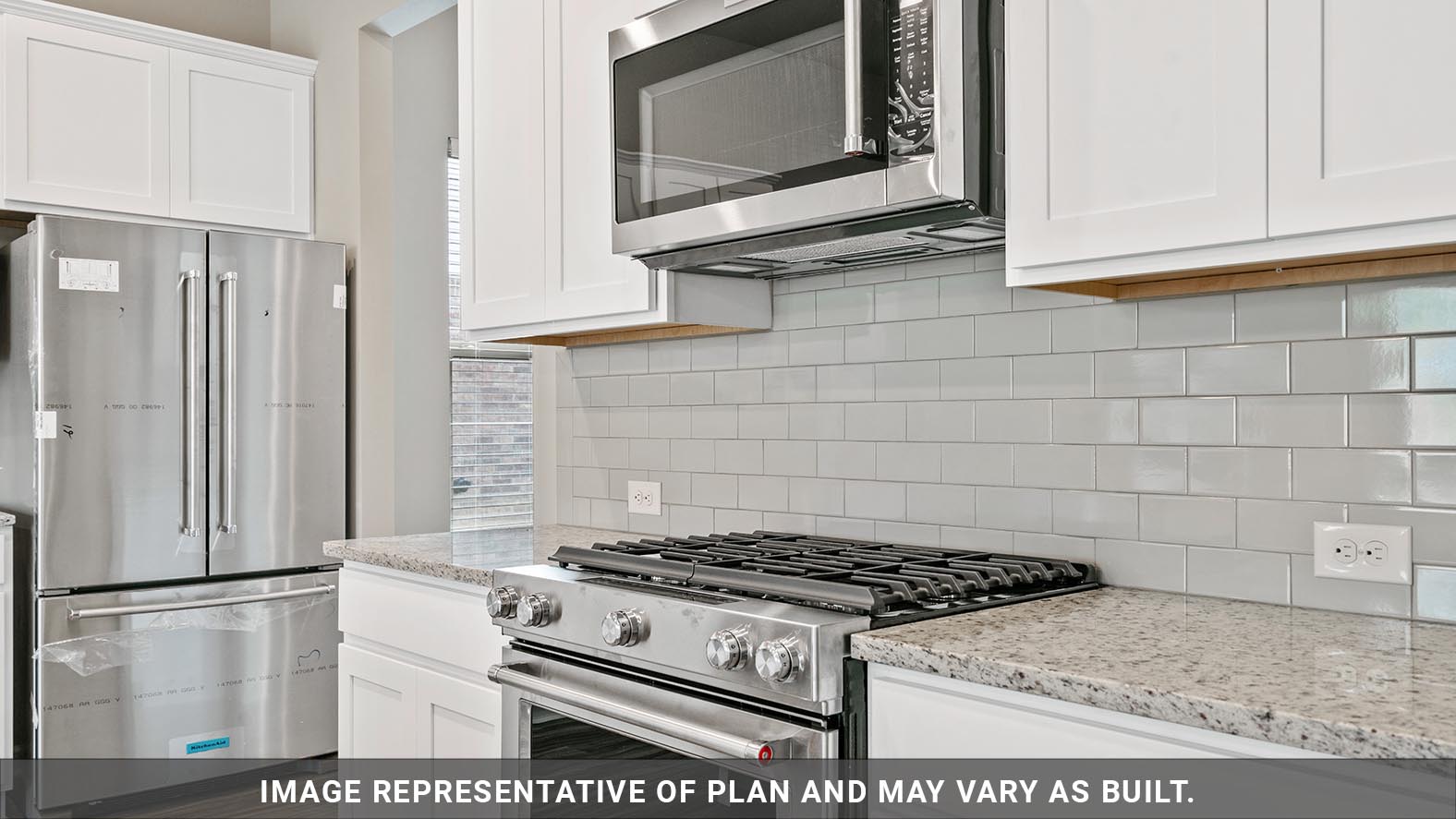 white kitchen cabinets with stainless steel appliances