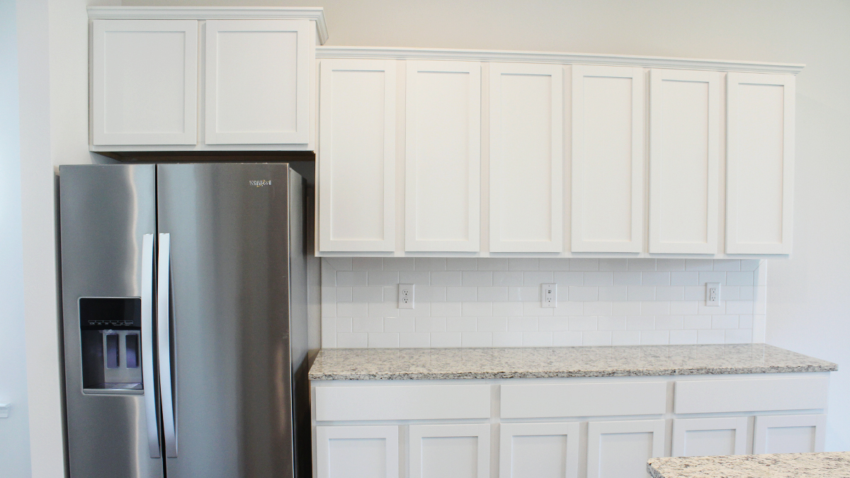 Side Pantry with soft close cabinets and Fridge area