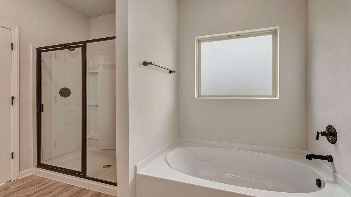 Separate shower and tub in primary bathroom