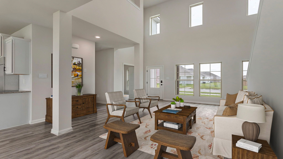 Spacious living room with opening to open-concept kitchen and dining room