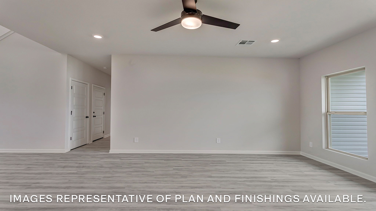 Open-concept living space with access to garage