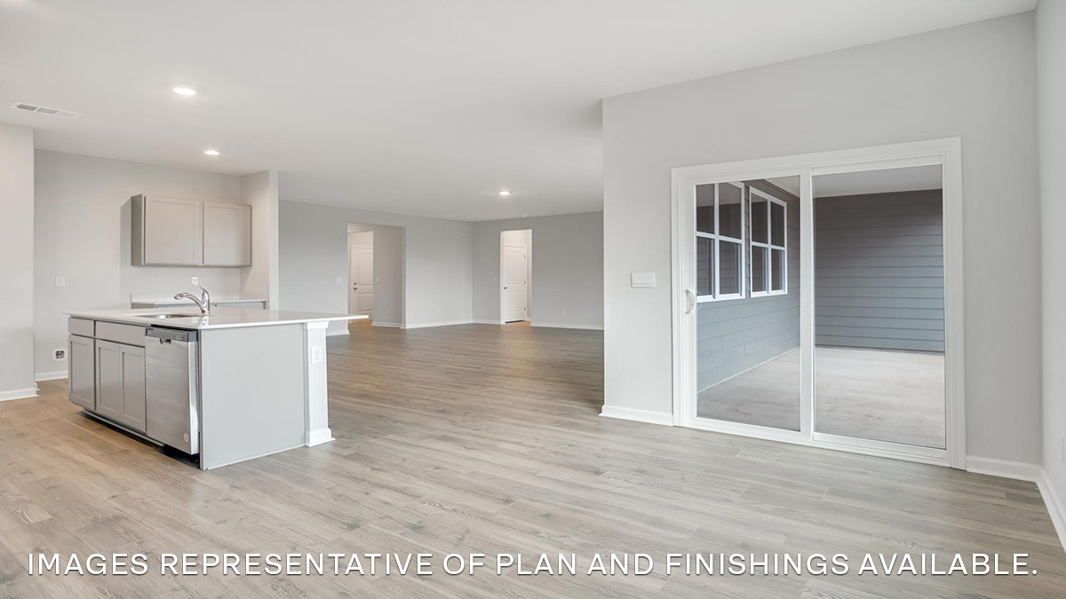 open concept dining room near patio and kitchen