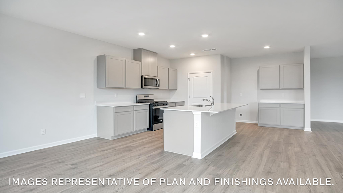 white kitchen island with stainless steel appliances
