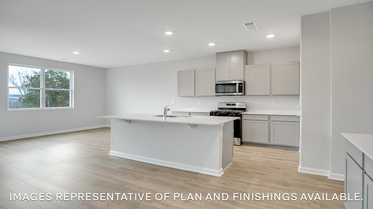 white kitchen island with stainless steel appliances