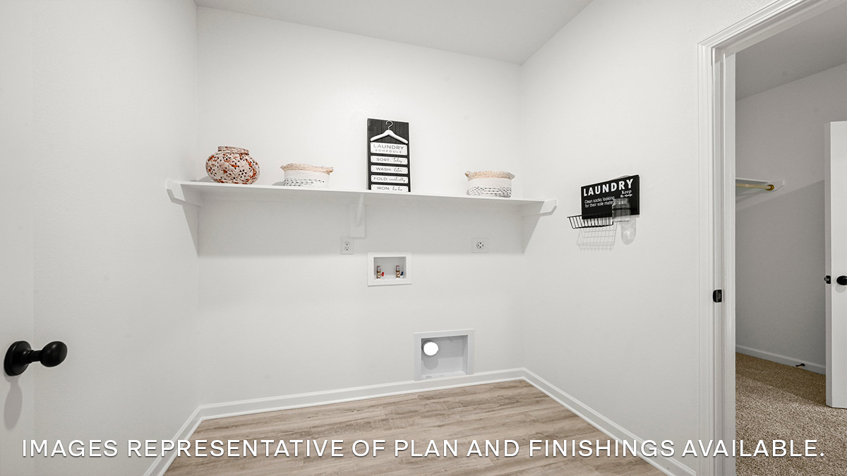 spacious laundry room with room for all your laundry needs and an ironing station