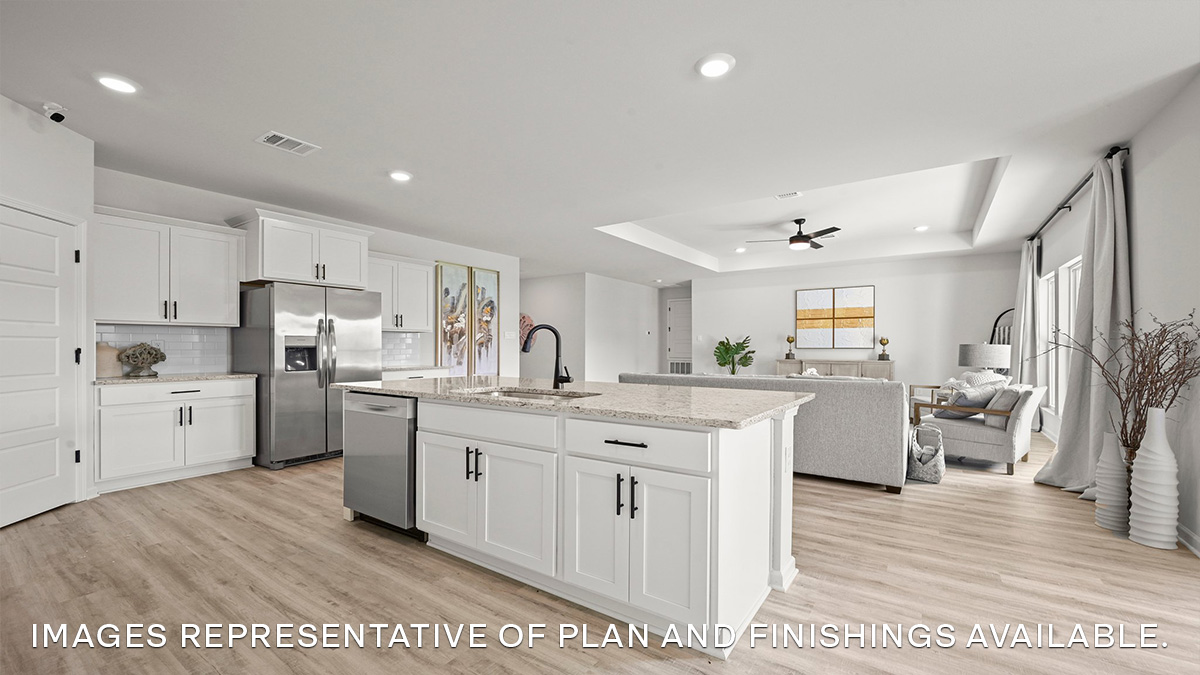 white kitchen island with living room in the front of the space