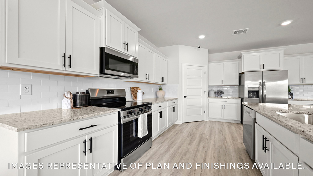 white kitchen cabinetry with stainless steel appliances and pantry access