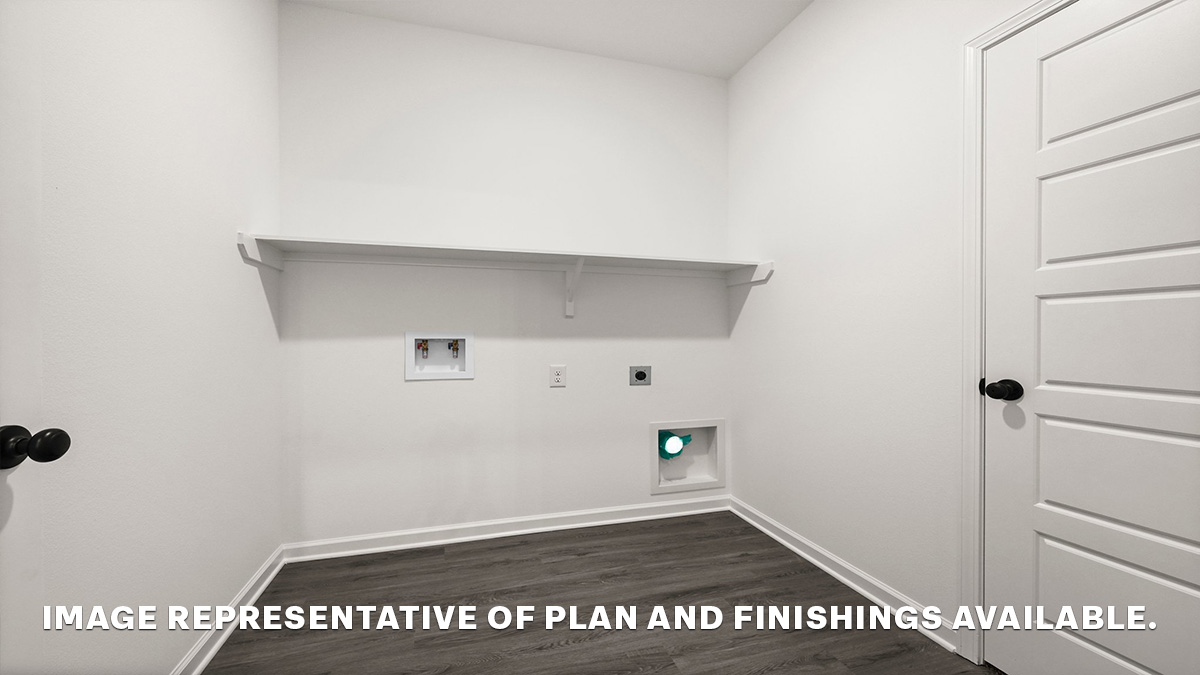 spacious laundry room with room for all your laundry needs and an ironing station