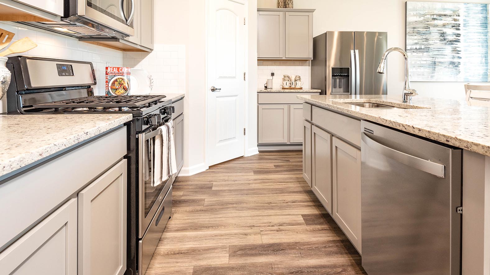 grey kitchen island with open-concept living and dining room