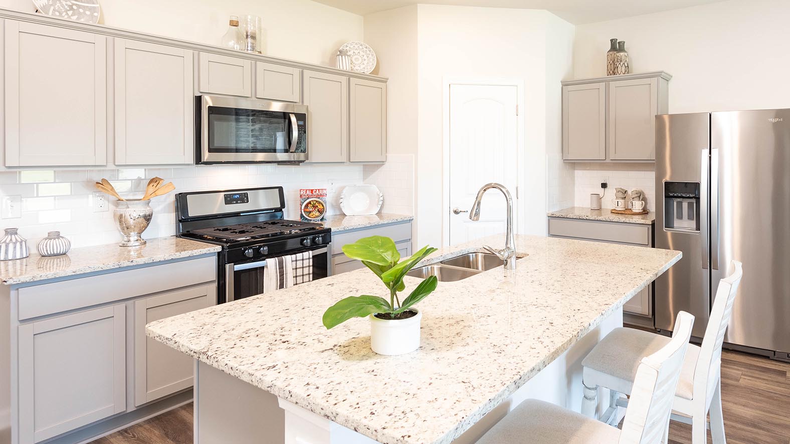 grey kitchen island with pantry access