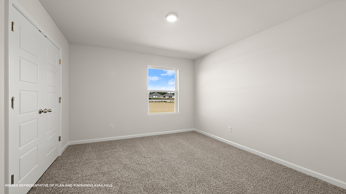 second bedroom with single window and room for up to a full size bed set