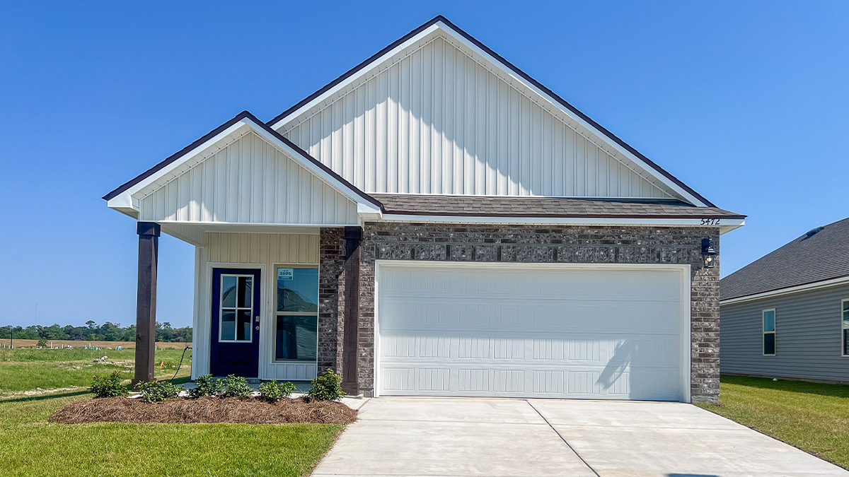 single-story home with brown brick and white vinyl siding and black front door with porch and two-car garage
