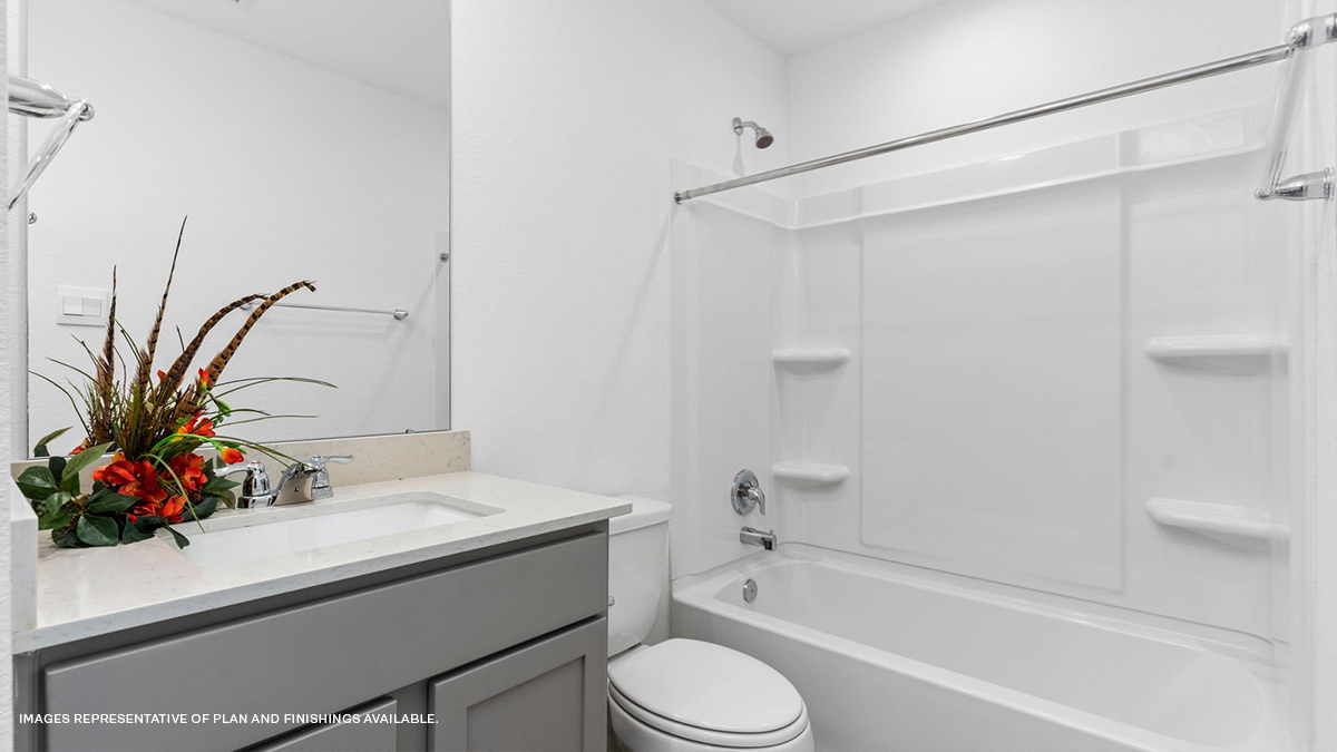 Second bathroom with vanity and bath tub shower combo