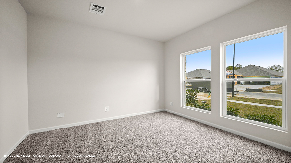 Second bedroom with dual windows and room for a queen bed