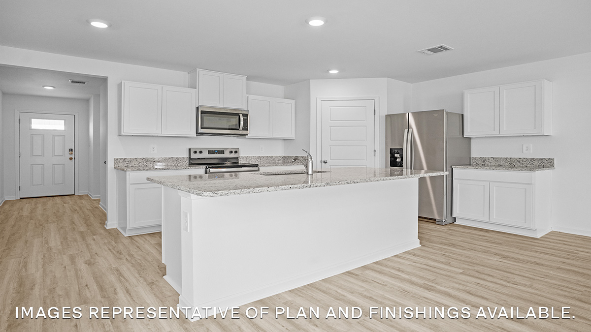 White kitchen island with stainless steel appliances and stools with pantry access