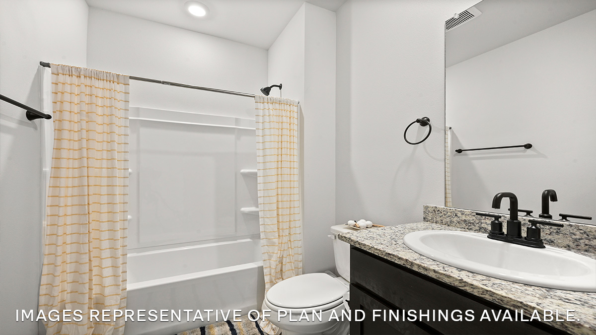 Guest bathroom with single vanity mirror and shower tub combo