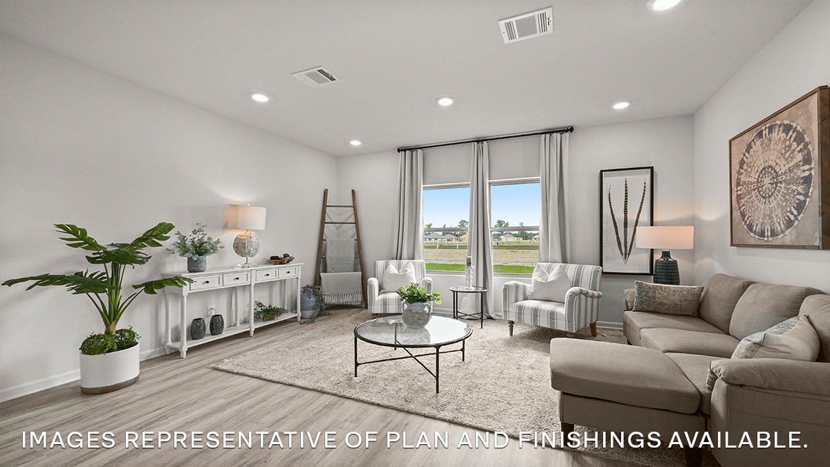 Living room with dual windows overlooking the backyard