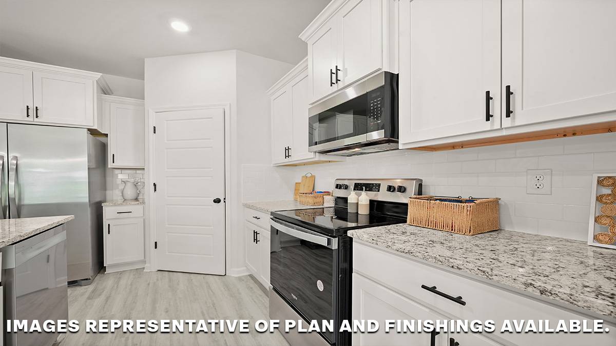 white kitchen island with stainless steel appliances and dining-room