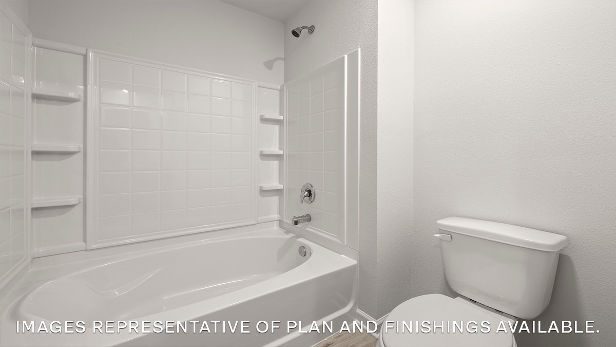 Primary bathroom shower tub combo and toilet