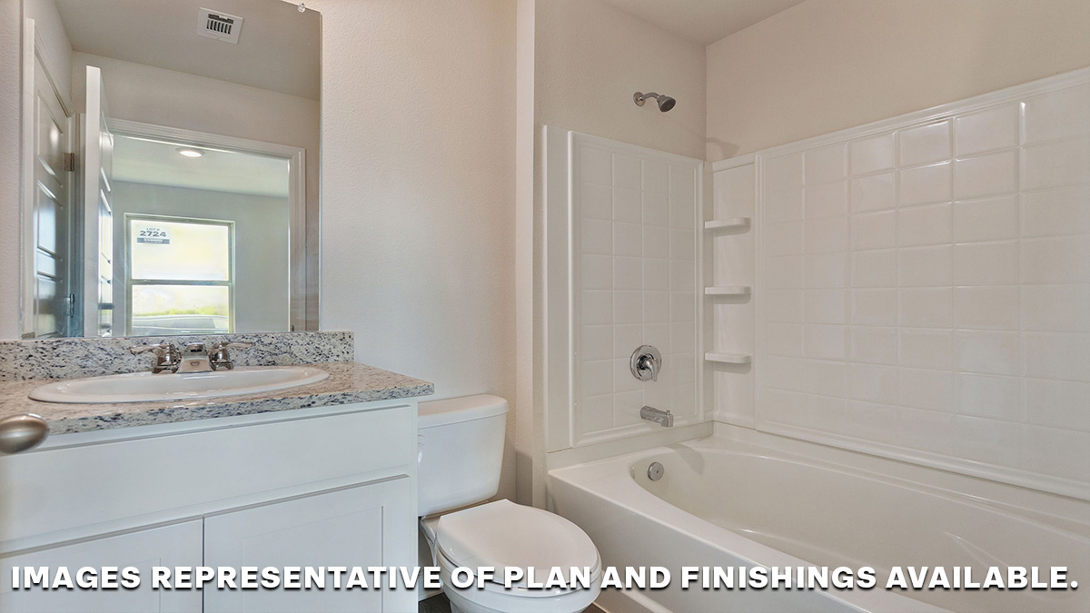second bathroom with single vanity, toilet and shower tub combo