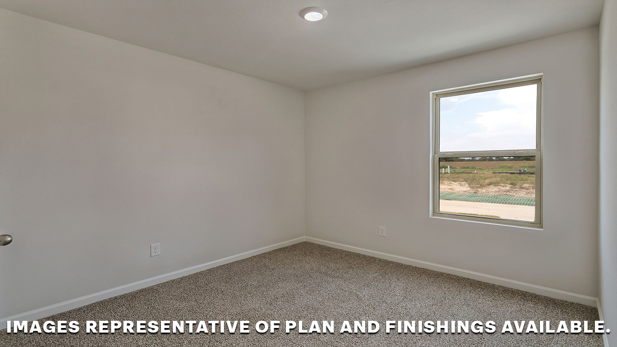 Primary bedroom with single window and space for king size bed set