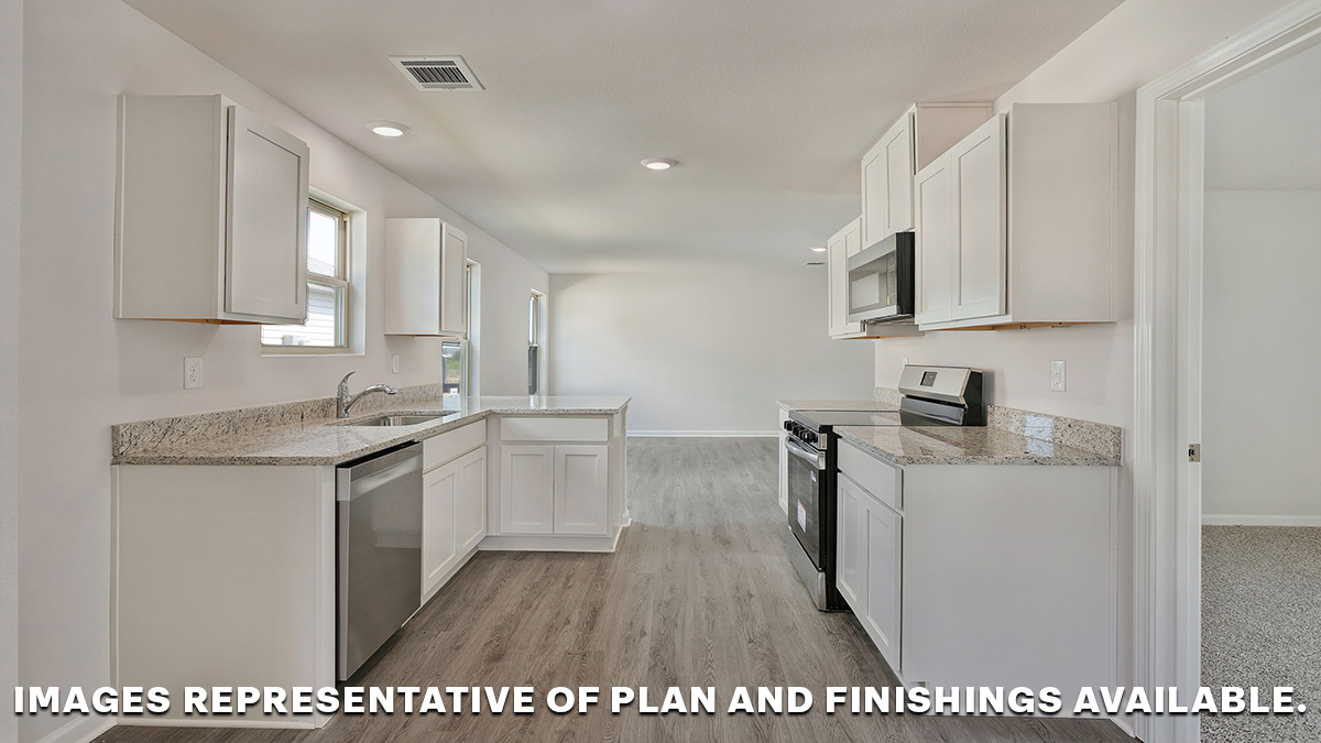 White kitchen cabinets with light gray granite with the opening to the living space