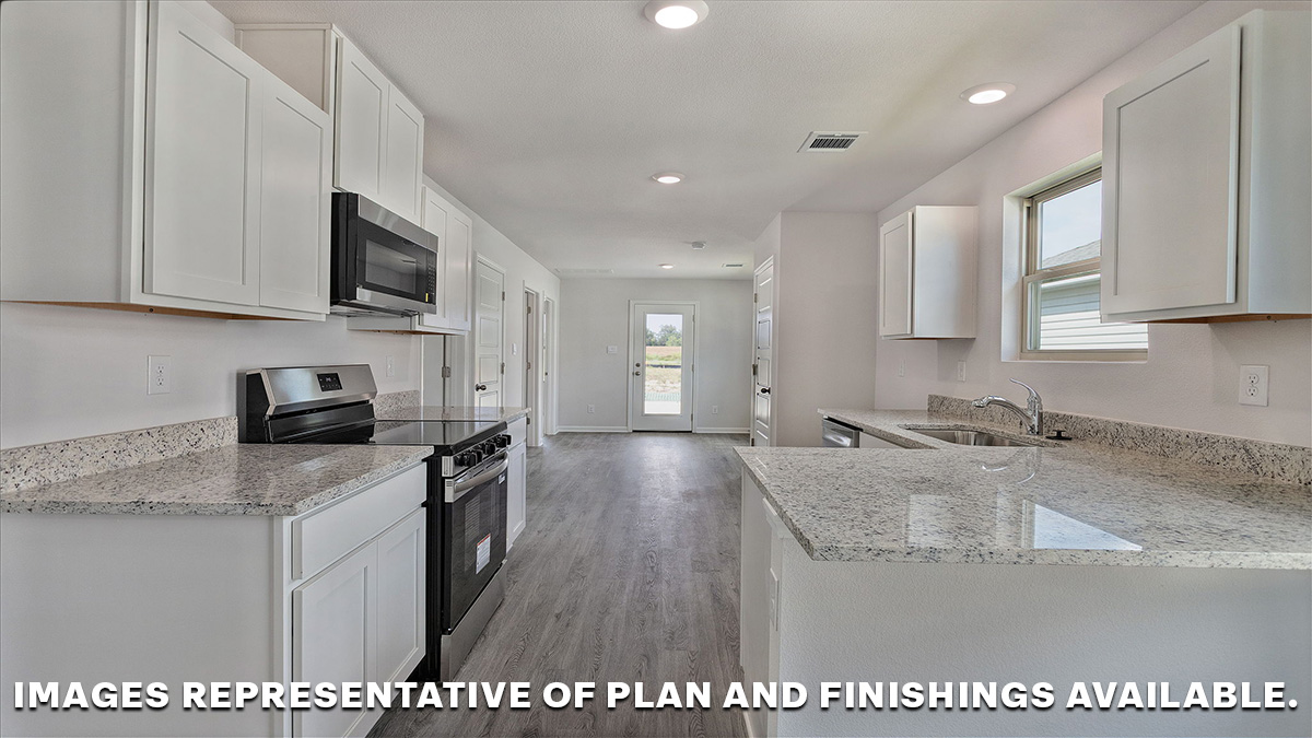 white kitchen cabinets with light gray granite with the opening to the dining space and primary bedroom