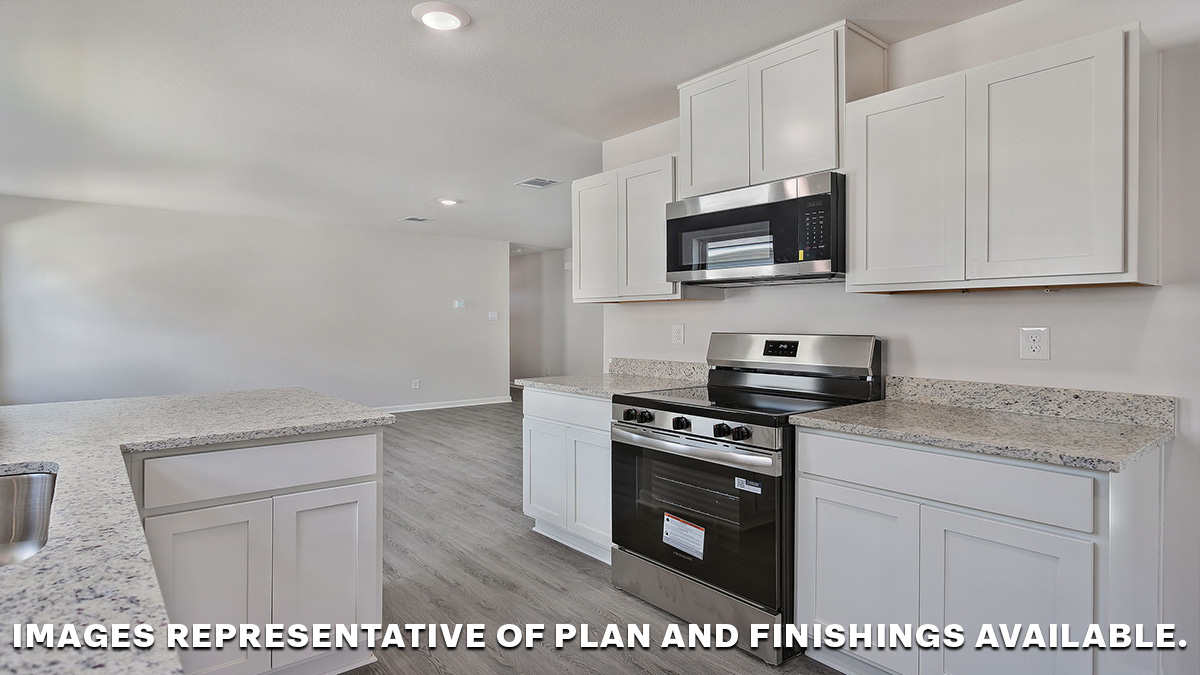 White kitchen cabinets with light gray granite with the opening to the living space