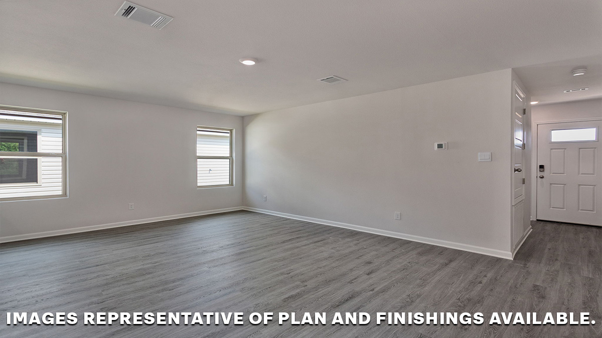 Open concept living space with hall to bedrooms