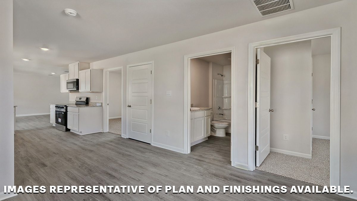 Dining space with primary bedroom nearby and full bathroom