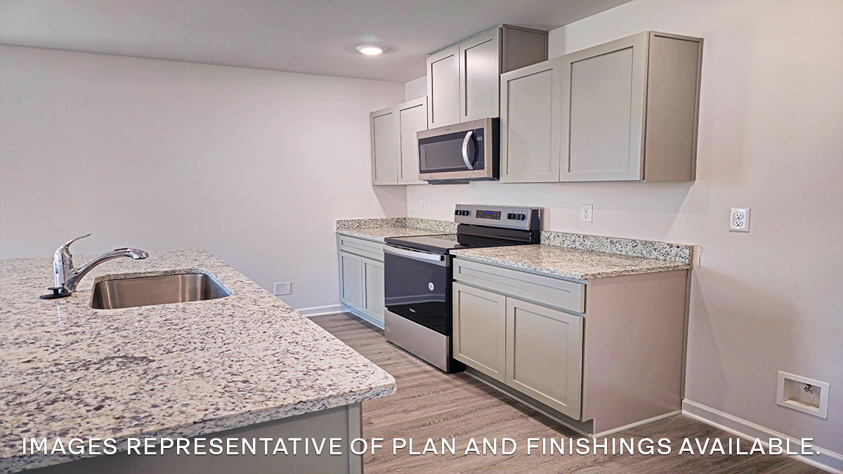gray kitchen island with stainless steel appliances
