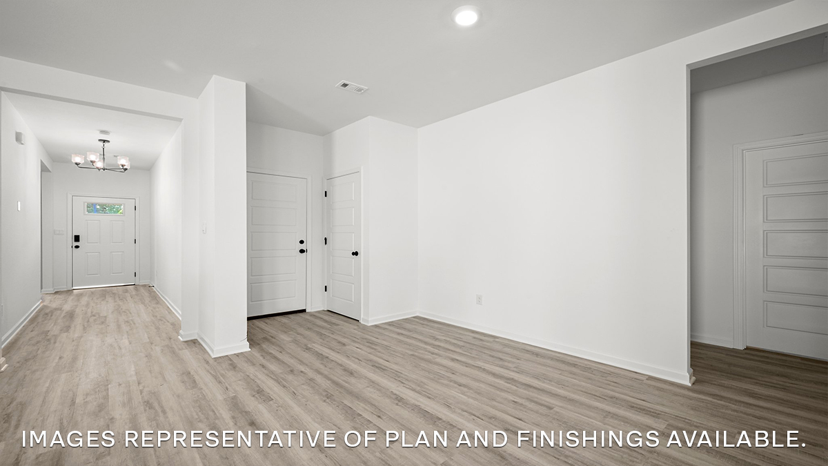 open-concept dining room with access to other bedrooms