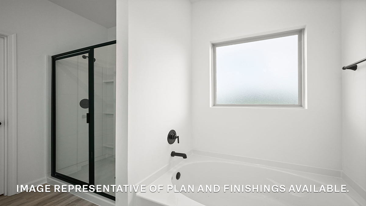 separate shower and soaking tub in the primary bathroom