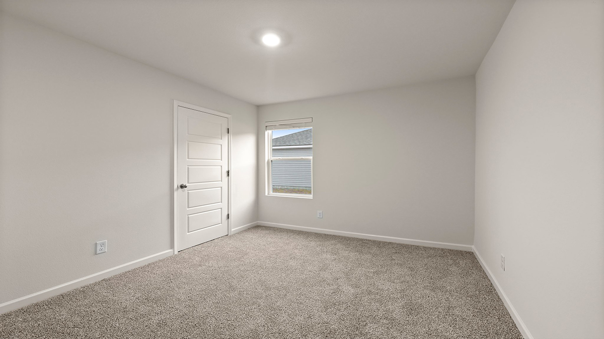 third bedroom with single window and room for a queen bed